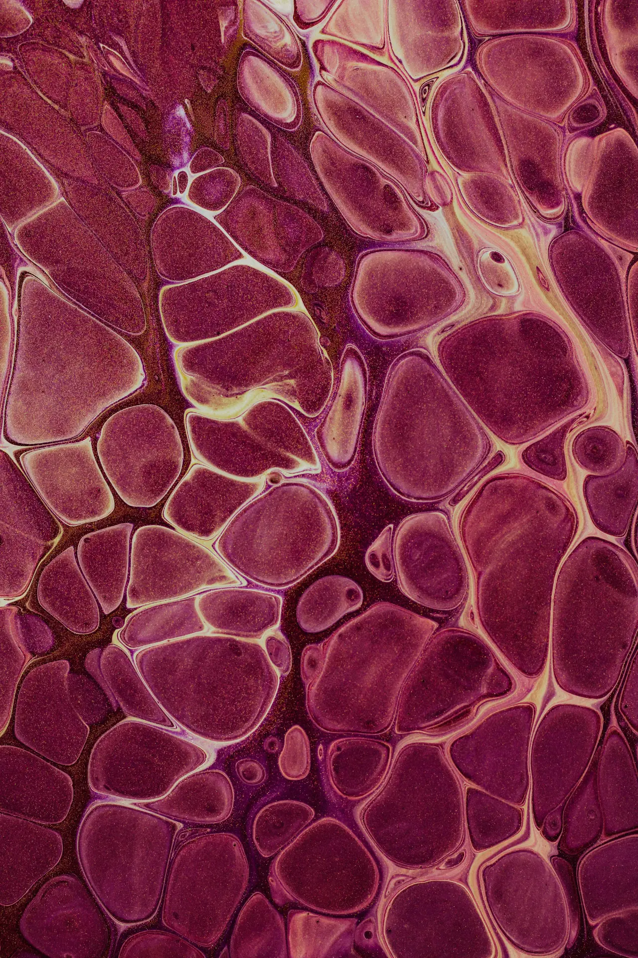 Soft marbled swirls of wine, amber and cream light.